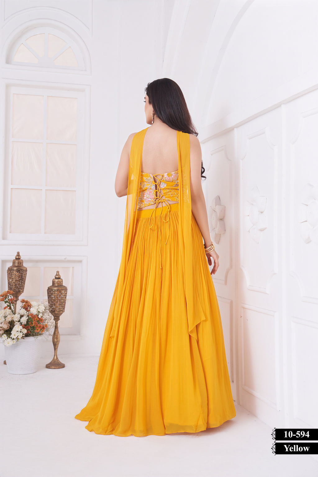 Radiate sunshine elegance with this stunning yellow embroidered lehenga set