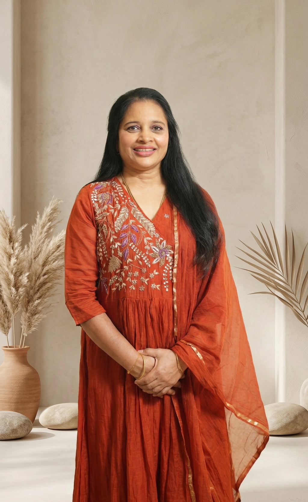 Elegant festive charm in a graceful rust-red ethnic set