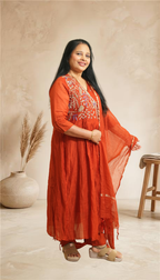 Elegant festive charm in a graceful rust-red ethnic set
