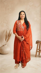 Elegant festive charm in a graceful rust-red ethnic set