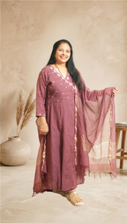 Grceful Festive Charm in a Rich Mauve Ethnic Suit