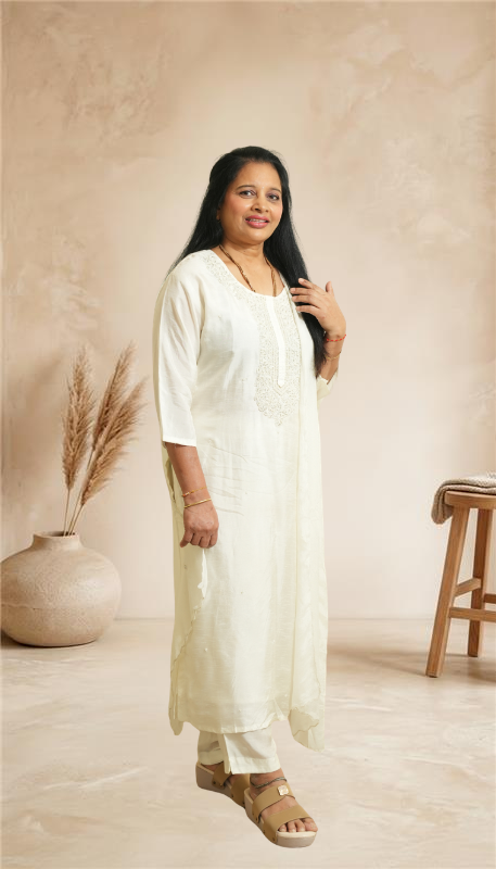 Elegant off-white ethnic set with graceful embroidery for a timeless, minimal look