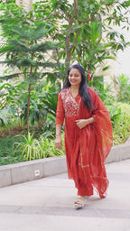 Elegant festive charm in a graceful rust-red ethnic set